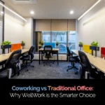Modern coworking office interior with shared desks, ergonomic chairs, and large windows overlooking a city view. Overlaid text reads, “Coworking vs Traditional Office: Why WellWork is the Smarter Choice,” with a blue checkmark icon in the top-right corner.